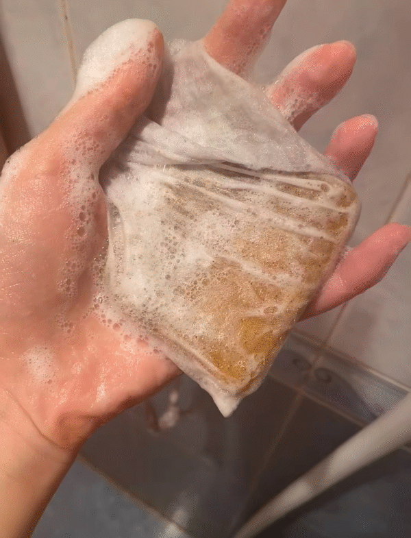 Luxurious creamy lather from Baxne shampoo bar for a premium wash experience.